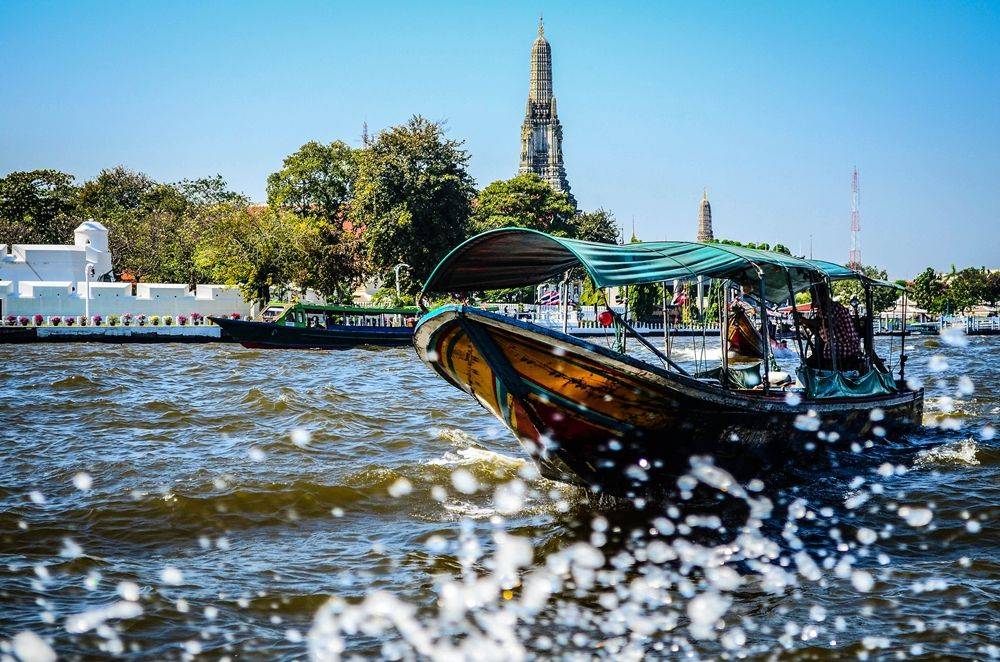 Boat ride along the river to visit temple and relax with massage