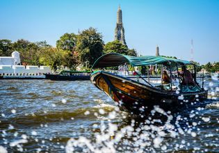 Boat ride along the river to visit temple and relax with massage