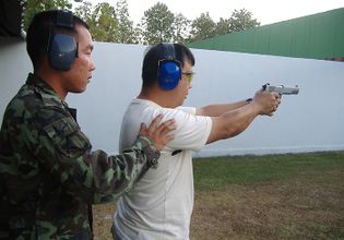 The Shooting Range in the Military Base with an Army Individual Instructor